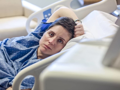 a woman in a hospital bed